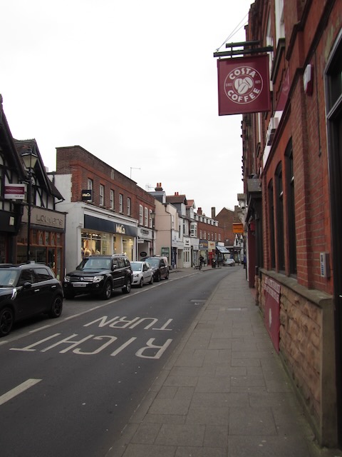 Image of the high street in Rickmansworth, UK showing brick facades and the sign for Costa Coffee.
